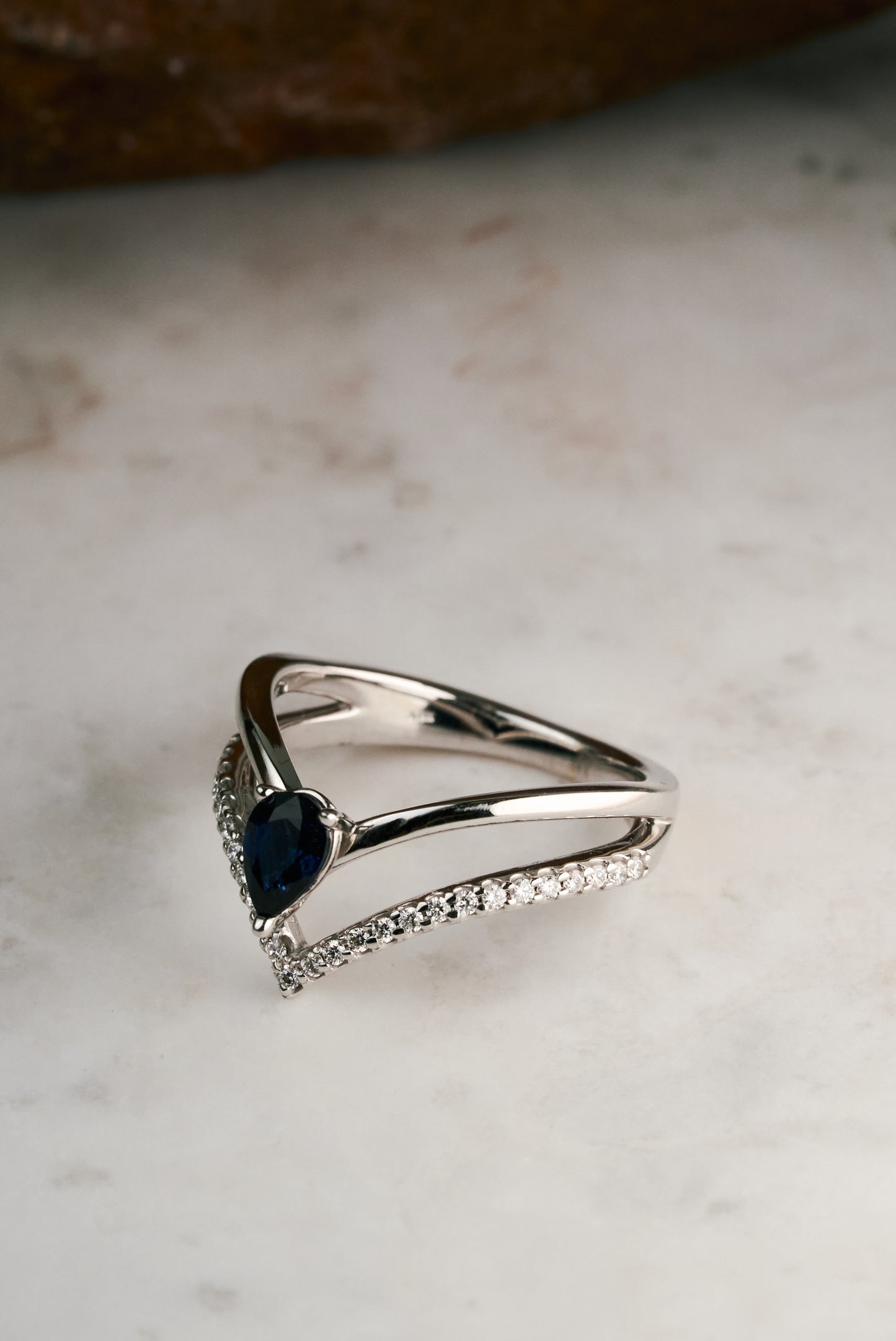 Accented Pear-cut Sapphire and Diamond Chevron Ring