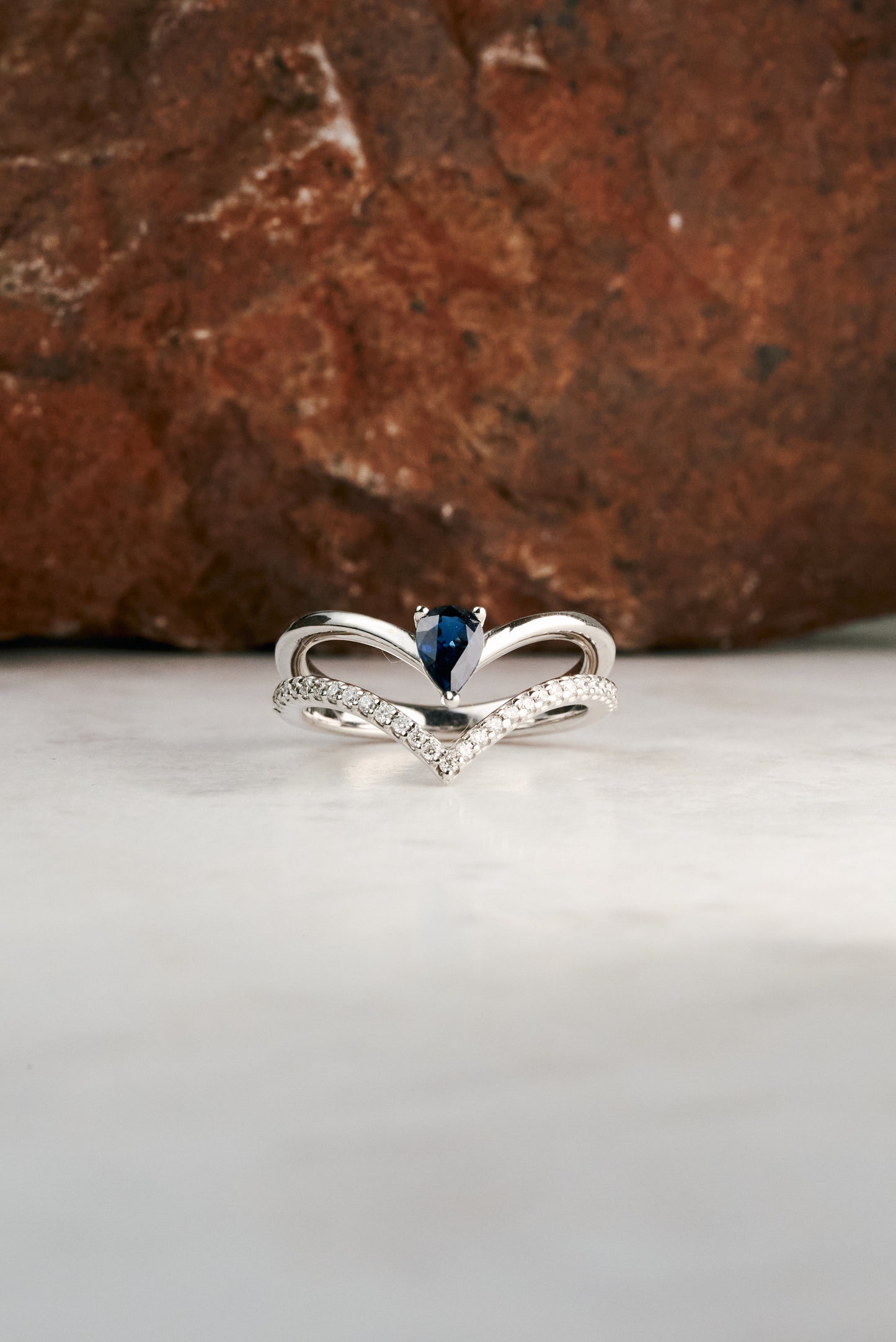 Accented Pear-cut Sapphire and Diamond Chevron Ring