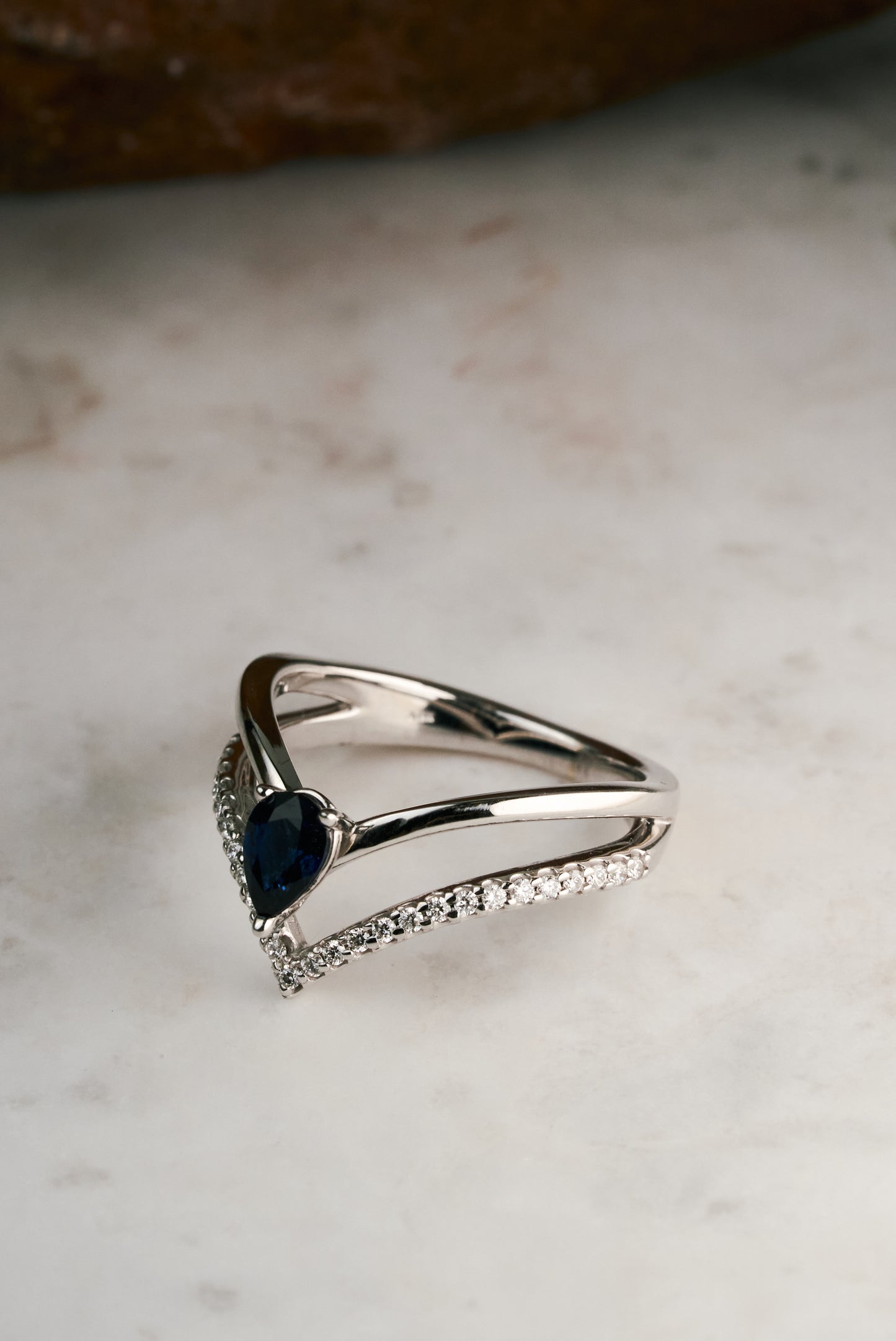 Accented Pear-cut Sapphire and Diamond Chevron Ring